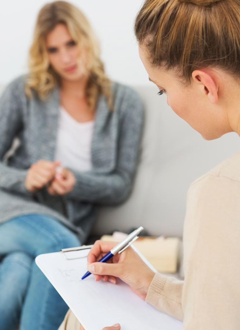 woman in therapy session with female therapist