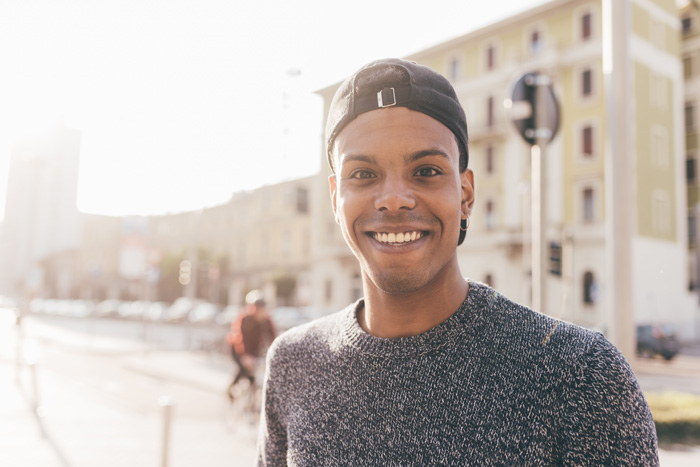 handsome smiling Black young man outside - SMART goals