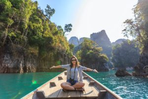 Photo by Te lensFix from Pexels: https://www.pexels.com/photo/photo-of-woman-sitting-on-boat-spreading-her-arms-1371360/ How to Enjoy Travel in Recovery