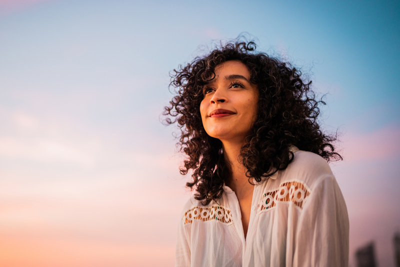 portrait of a content woman at sunset